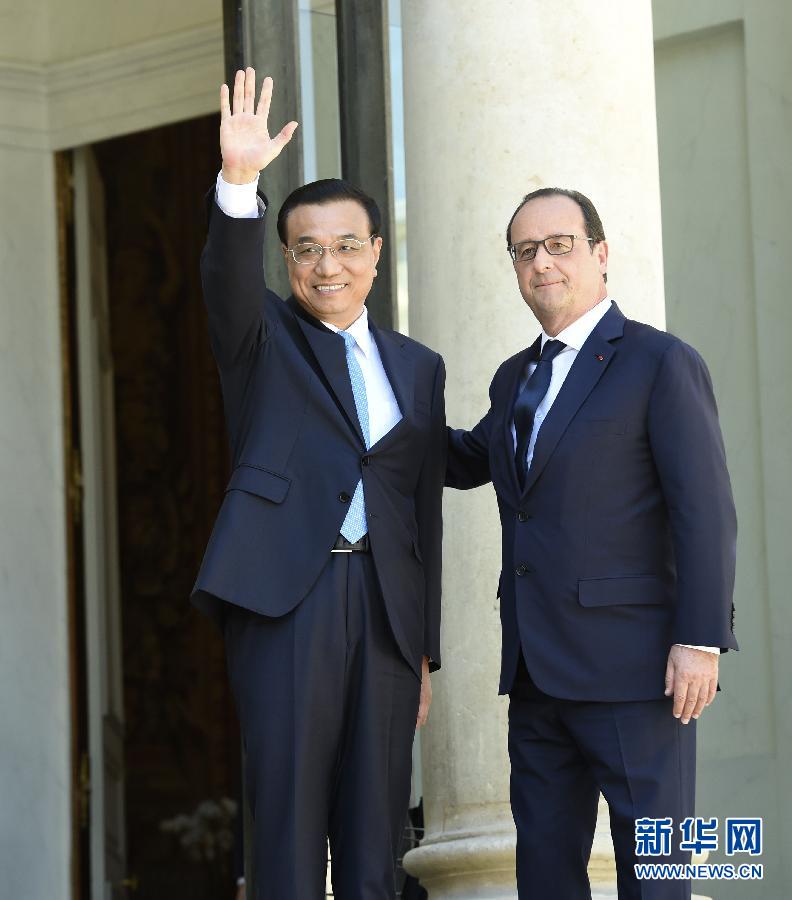 當?shù)貢r間6月30日下午，中國國務(wù)院總理李克強在巴黎愛麗舍宮會見法國總統(tǒng)奧朗德。 新華社記者李學仁攝 